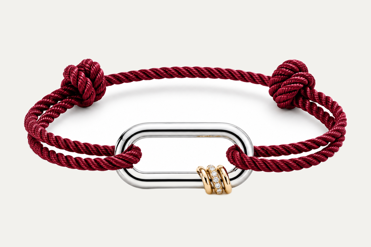 NEXUS LUMINA — Garnet Red on a warm off-white background