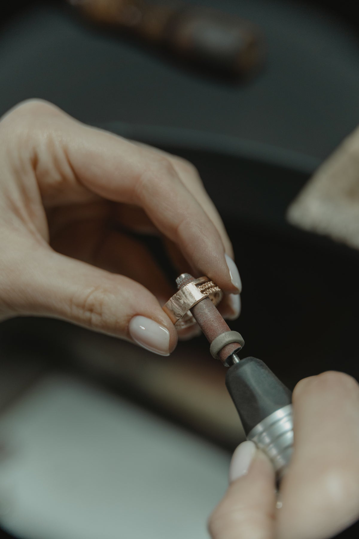 Close-up of a jeweler polishing a metal ring with a rotary sanding tool. Photo: Tima Miroshnichenko / Pexels.